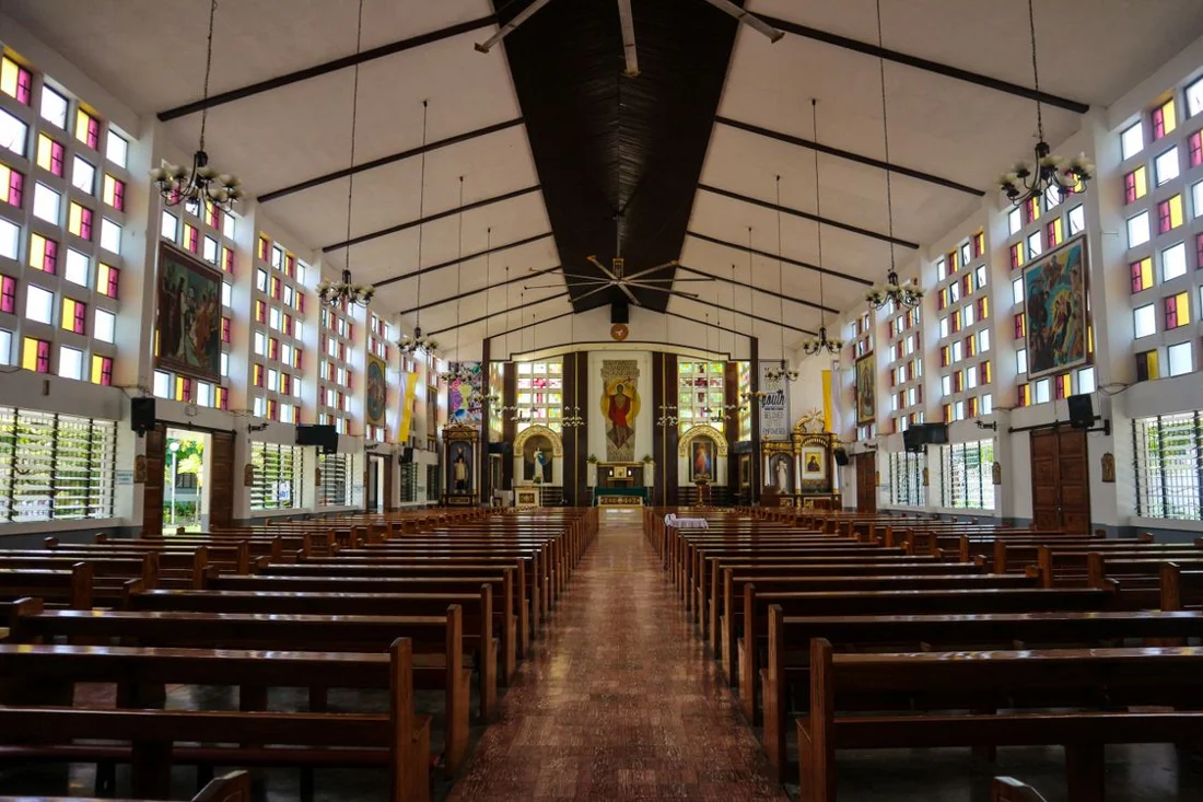 Church sanctuary with rows of pews